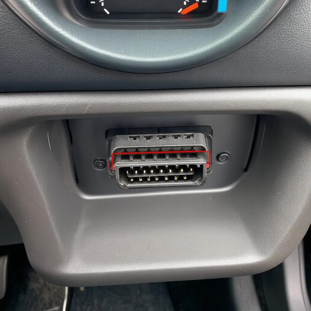 OBD-II port under dashboard