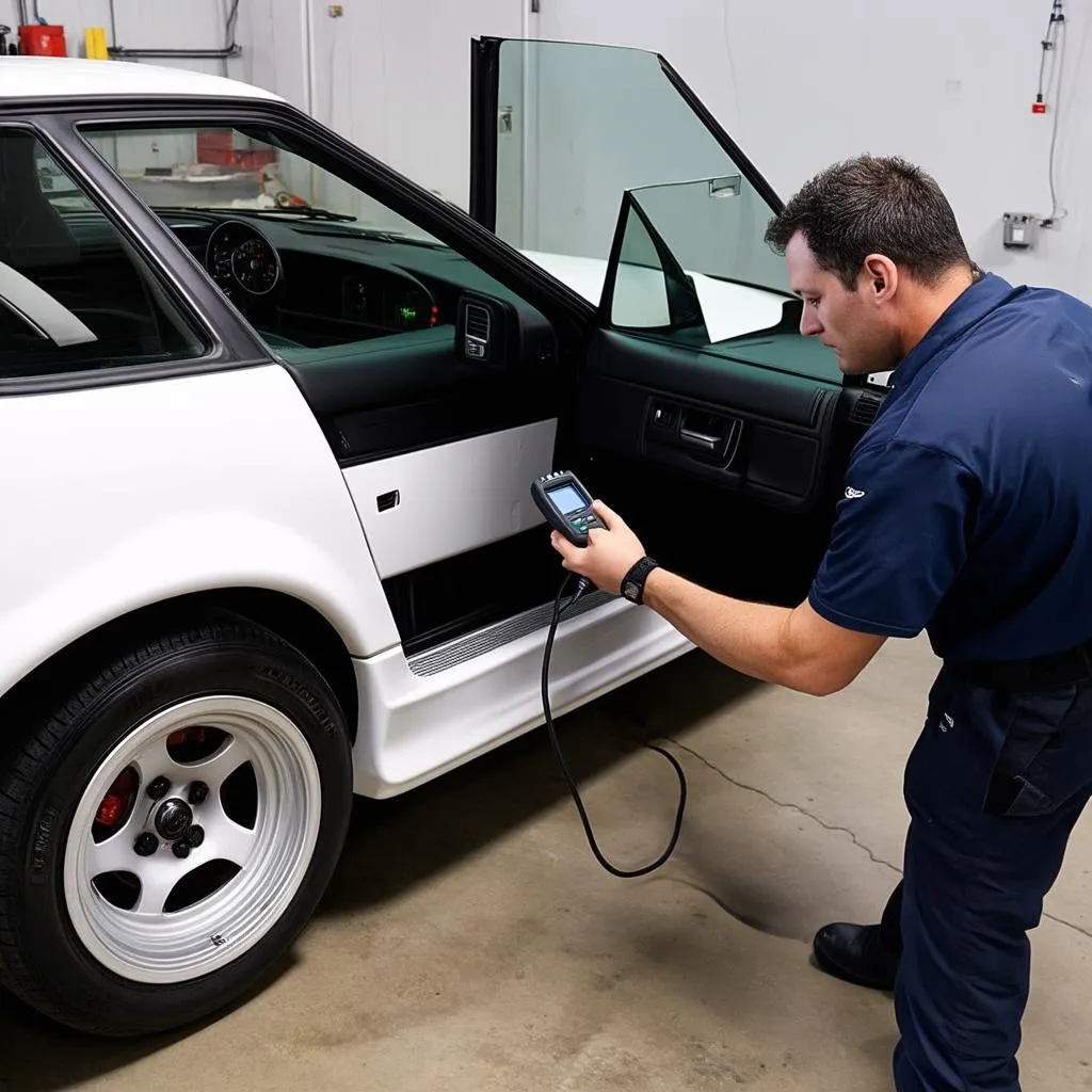 Mechanic Using OBD Scanner on Nissan 240sx