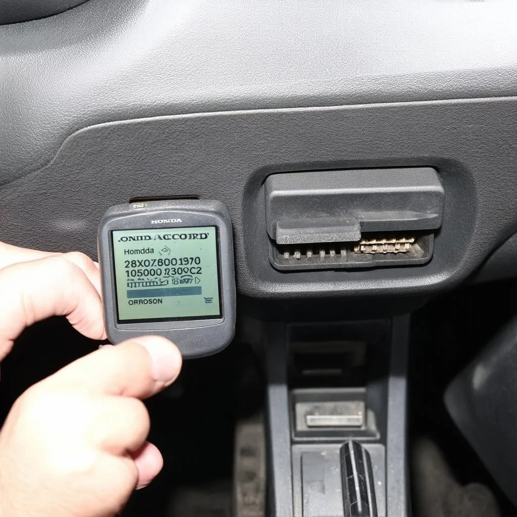 OBD2 Scanner Connected to Car