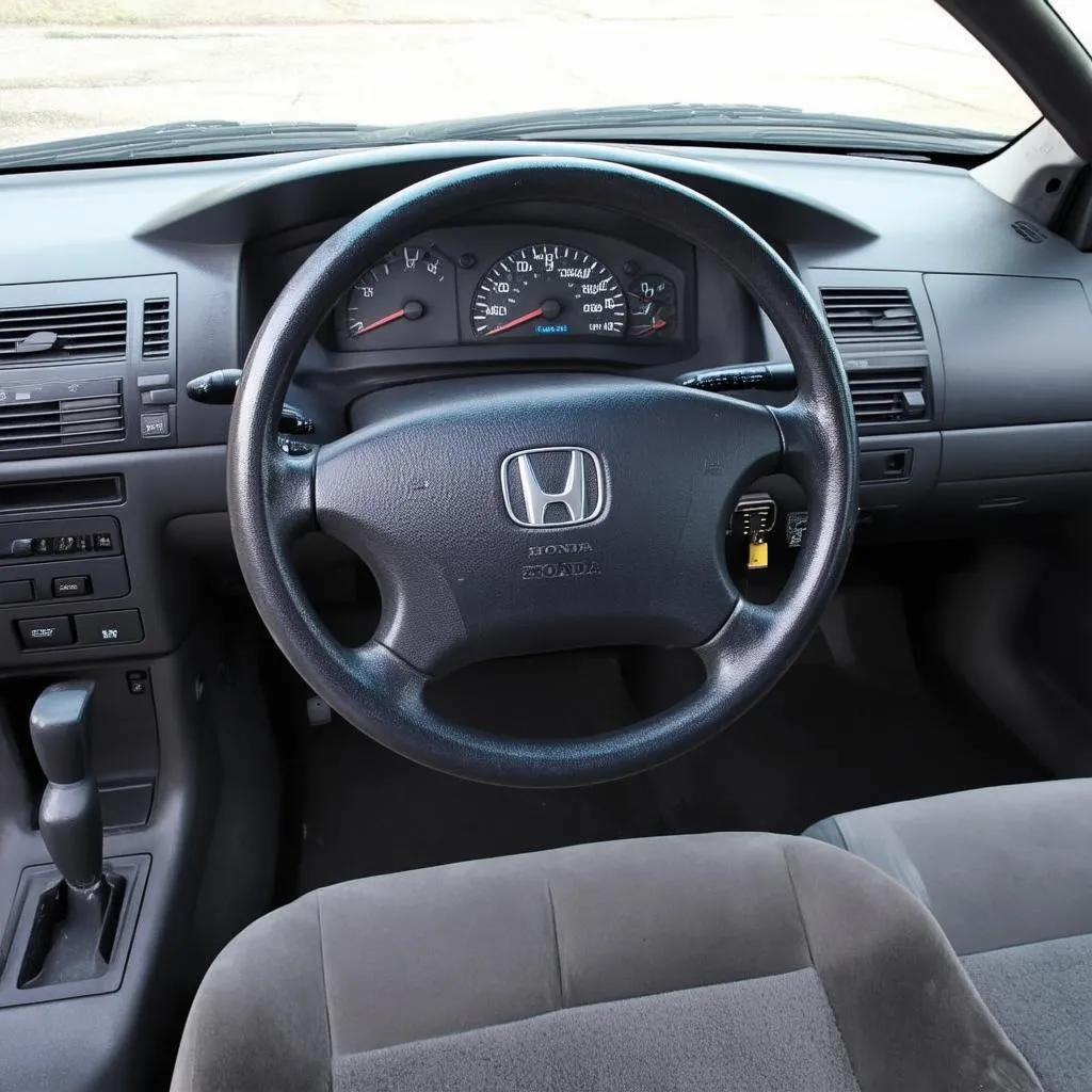 1999 Honda Accord Dashboard with OBD2 Port Highlighted