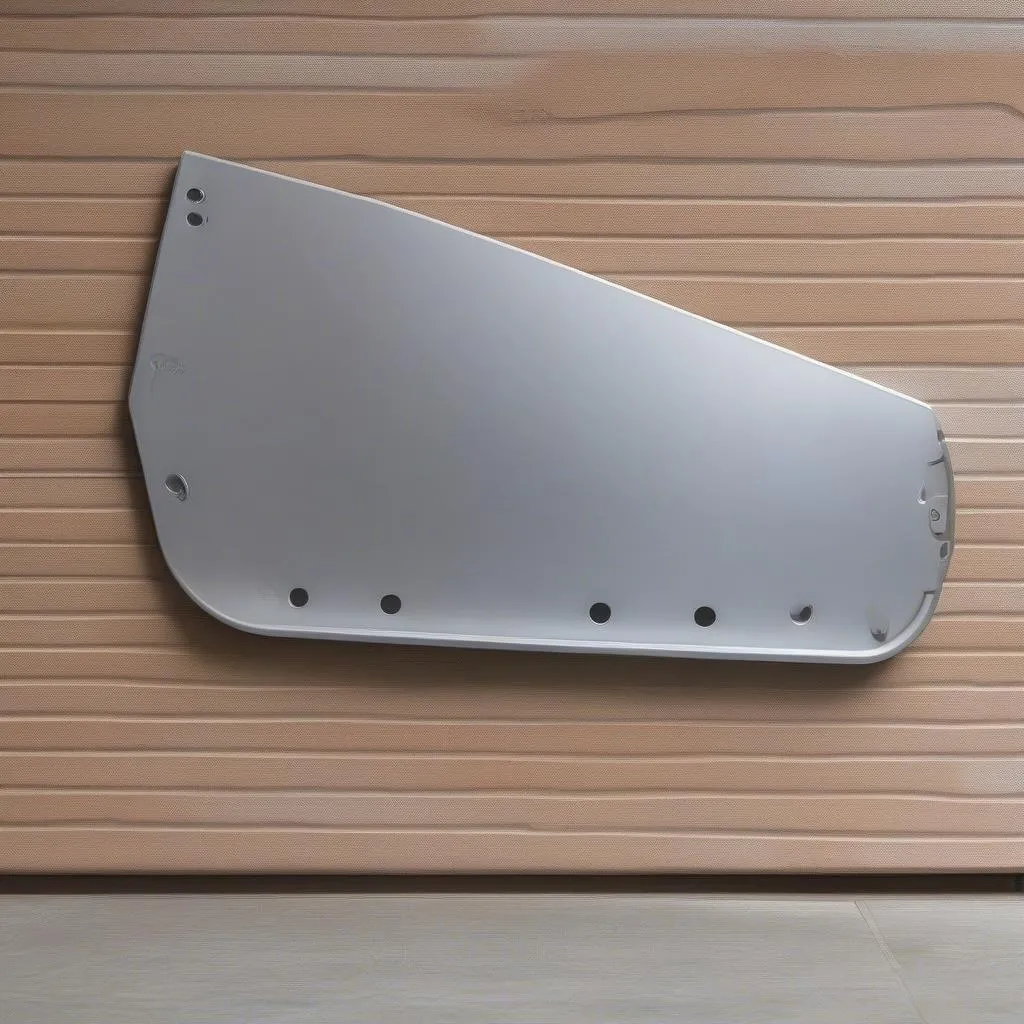 A foldable transfer board leaning against a wall.