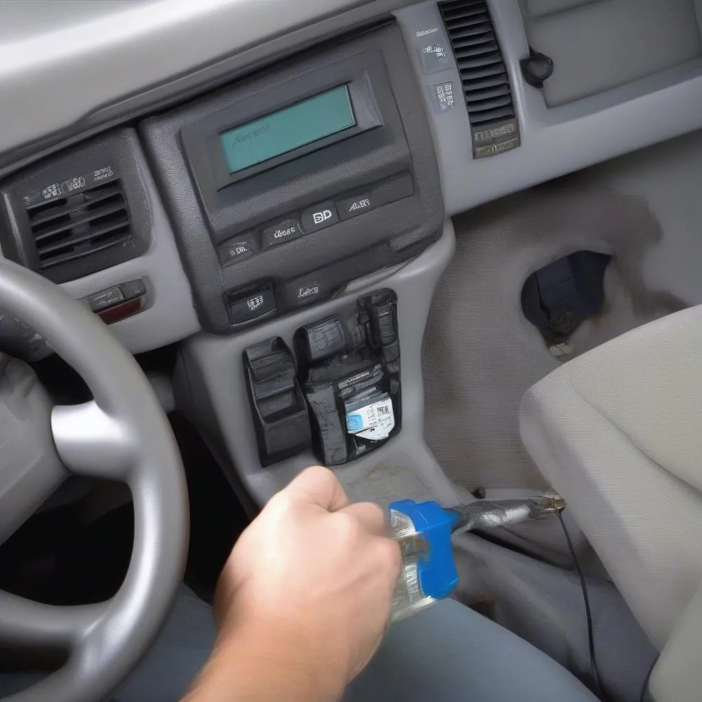 Inspecting the OBD port on a Ford Windstar