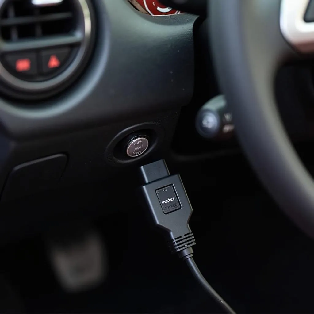 Mazda Miata with OBD adapter connected