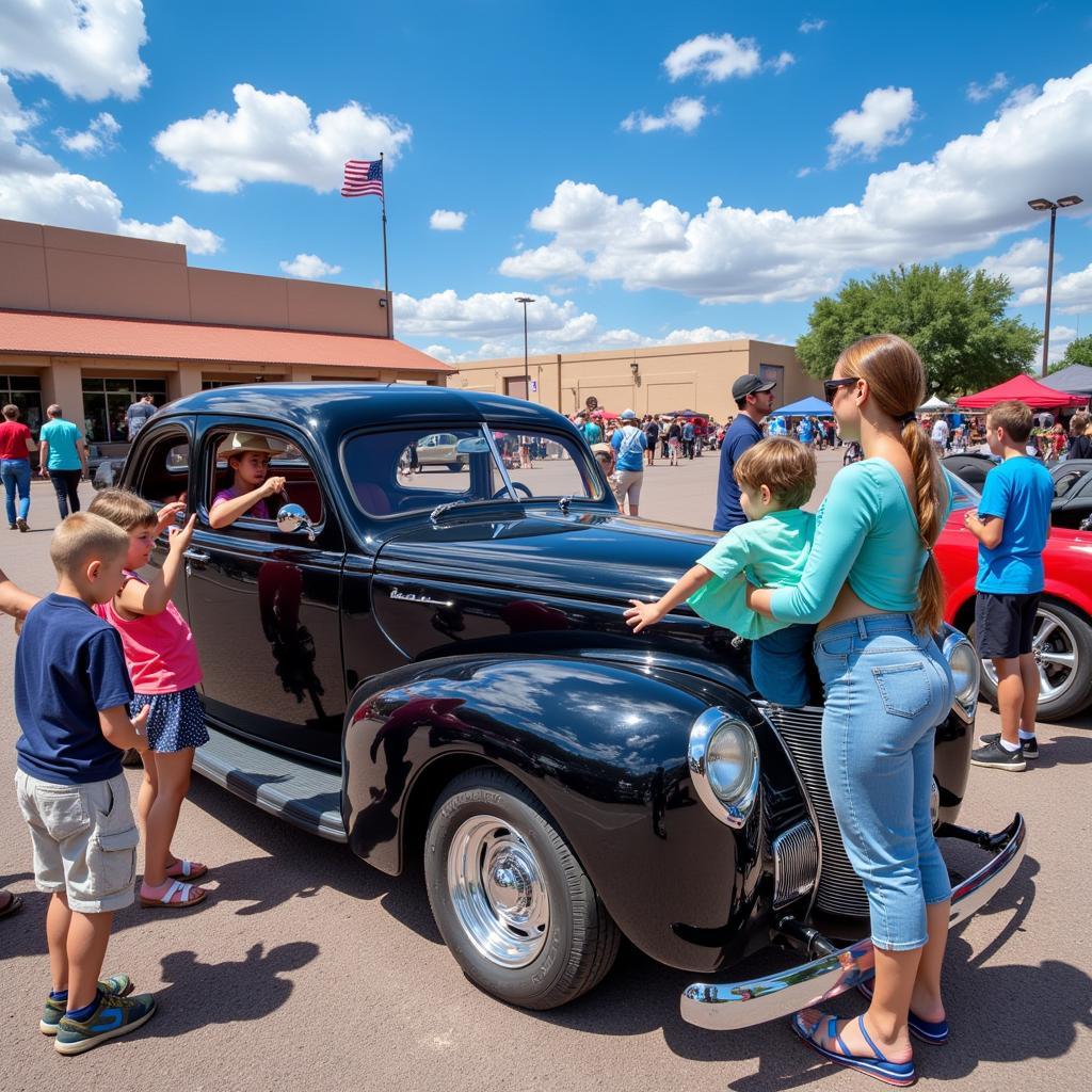 Families enjoying the Albuquerque Lowrider Car Show