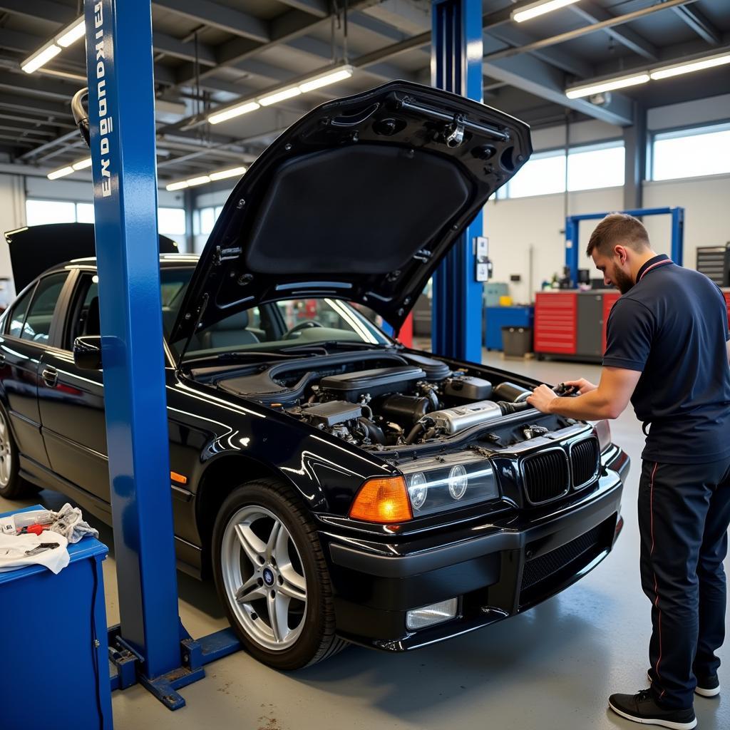 Mid-lift used for engine repair in a professional garage