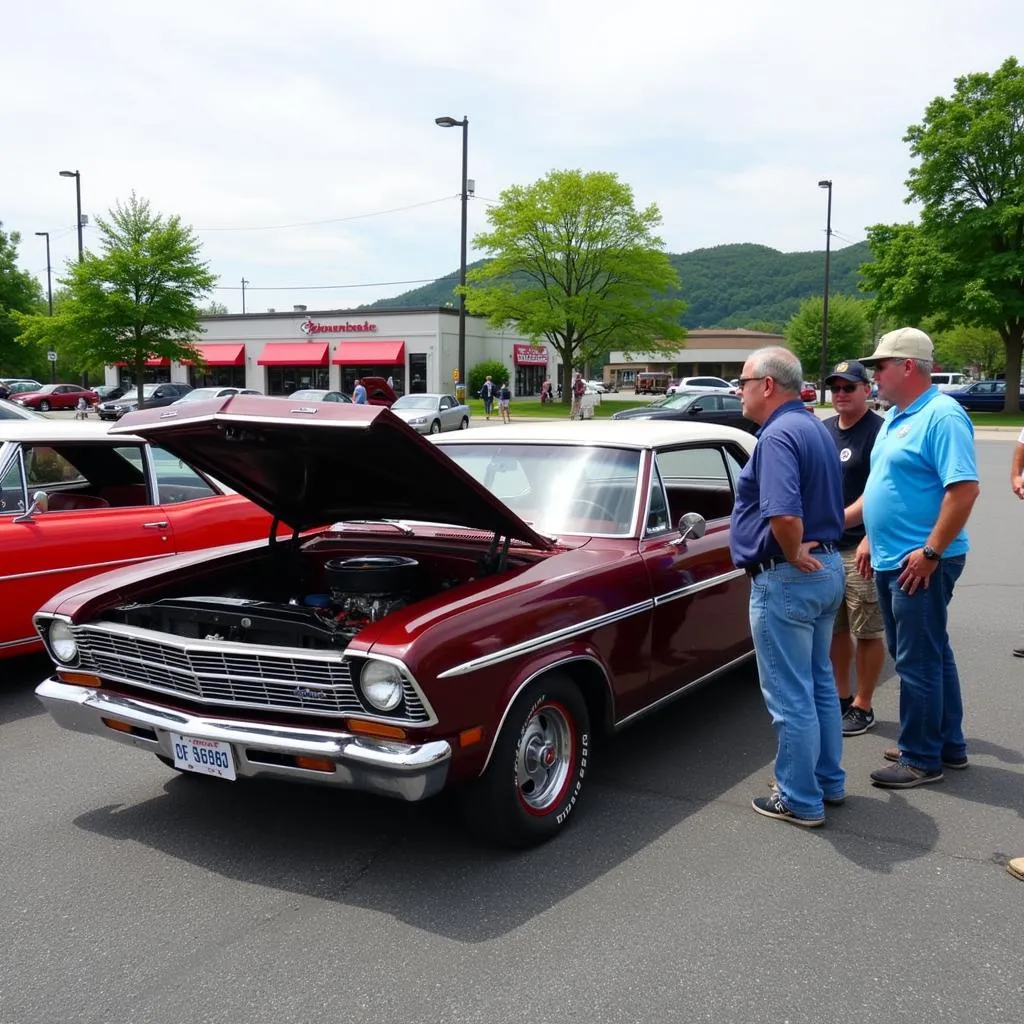 A group of people admiring a classic car at a car show in Martinsburg, WV.