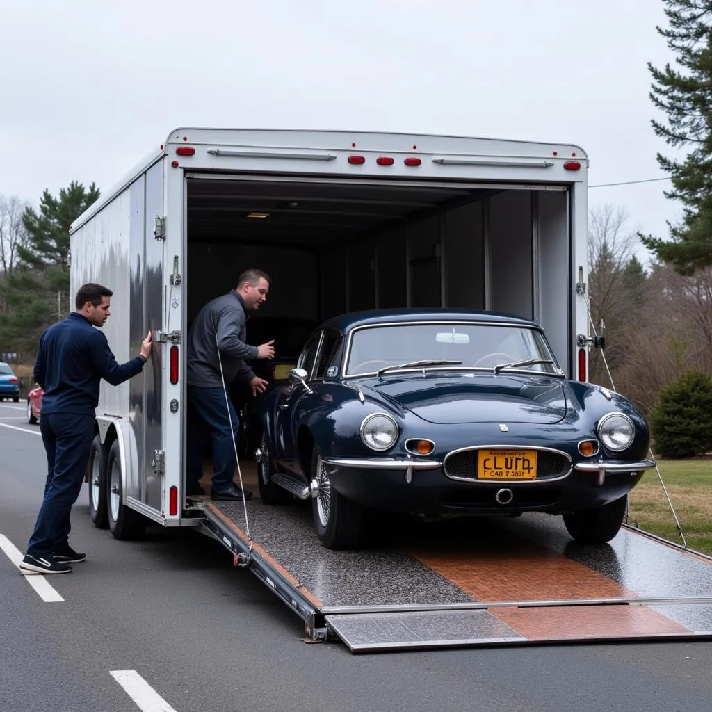 Classic Car Loaded onto Enclosed Trailer for Transport 