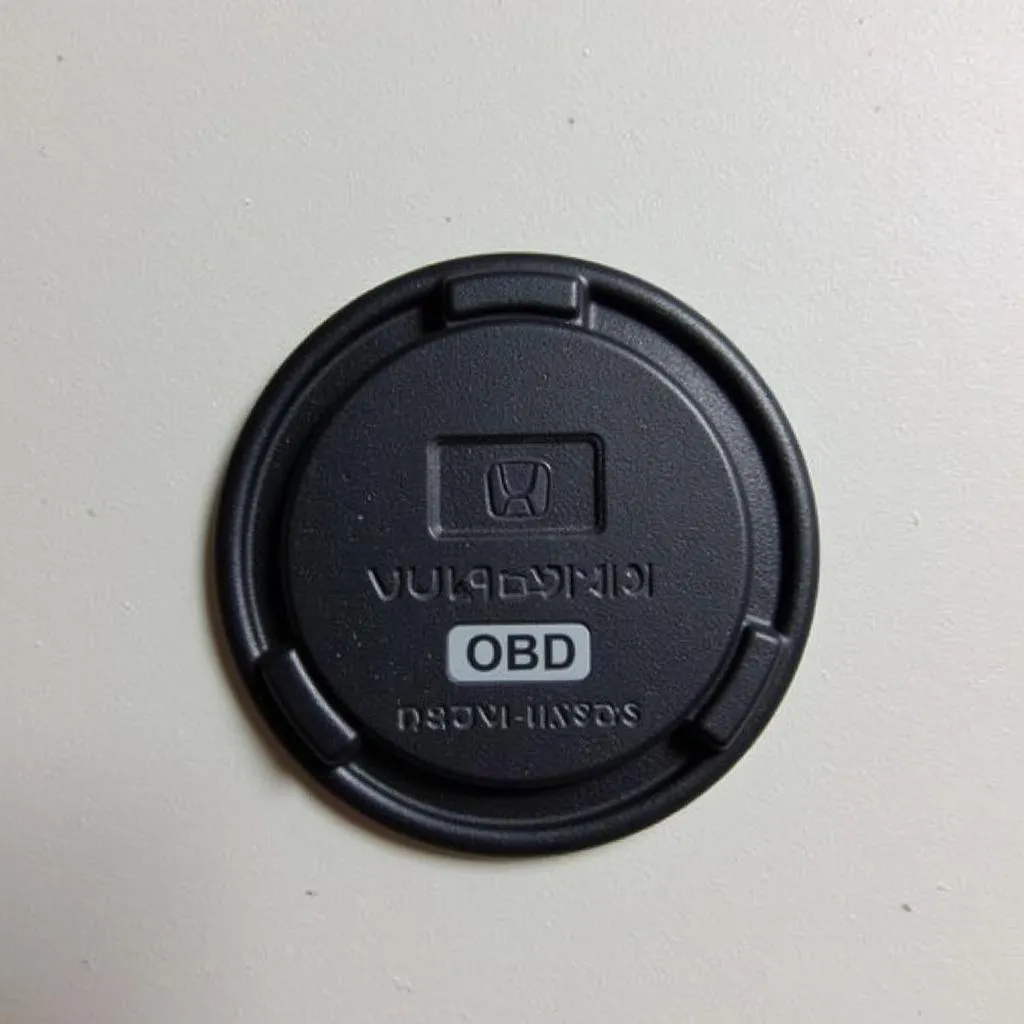 OBD port cover in a Honda Accord