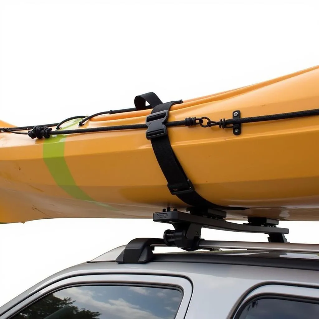 Kayak Secured with Straps on Roof